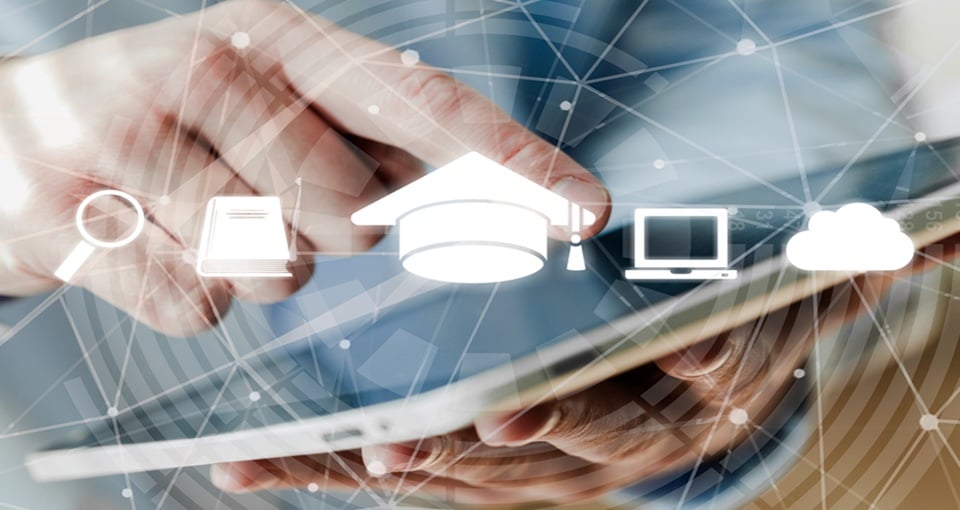A person uses a tablet with semi-transparent icons overlaid, including a magnifying glass, book, graduation cap, computer monitor, and cloud, symbolizing digital education and online learning. EFESO Management Consultants